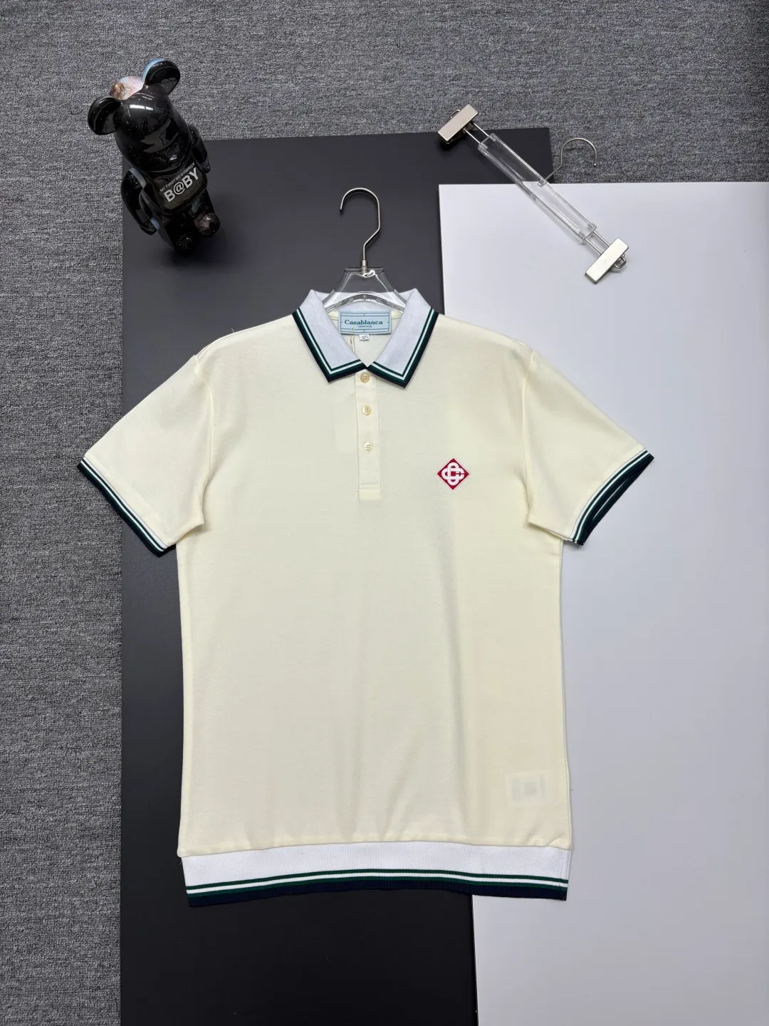 CASABLANCA New Arrival embroidered Polo shirt, original fabric, official Same Style, made of pure cotton pique fabric, customized vat-dyed fabric, feels very comfortable and smooth, very wide and stylish, produced by the first-line brand Factory, imported Behringer embroidery machine, embroidery is full and textured, collar and collar ribs are woven with imported yarn, does not deform after long-term wear, the latest New Arrival style in spring and summer, fashionable and individual Super Versatile, a good-looking one. It is very suitable for both men and women. It is a must-have for everyone. Color: Black White, Apricot, Blue Khaki Size: M-3XL
